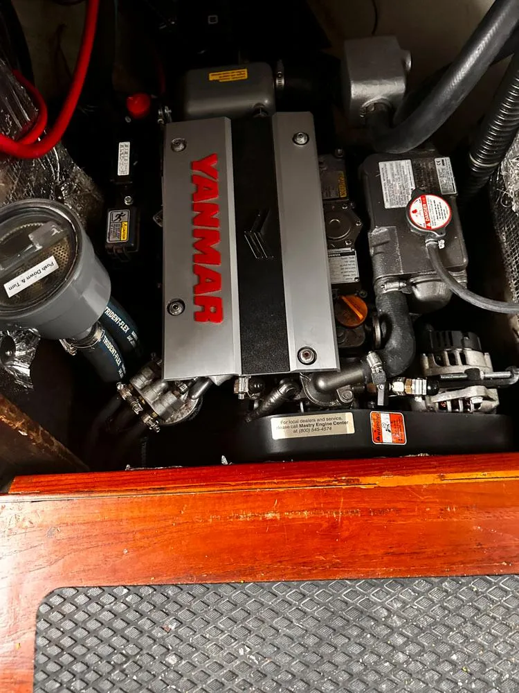 Slide: The Image of 1976 Downeast 38 engine compartment with Yanmar diesel engine. - 25