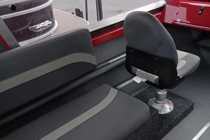 Slide: The Image of 2024 Spartan 215 Athens boat interior with seating and steering chair. - 9