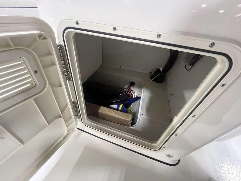 Slide: The Image of Storage compartment of 2024 Key West 179 FS boat with equipment inside. - 3