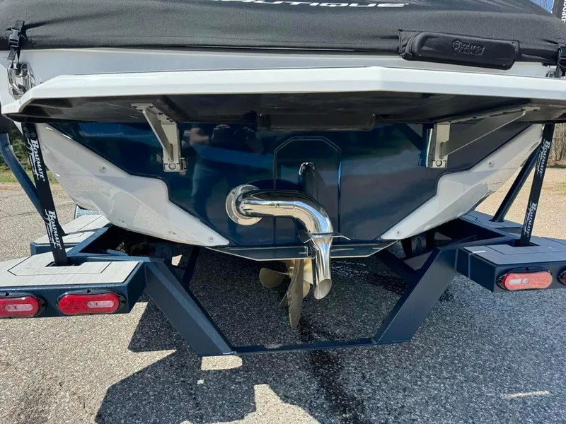 Slide: The Image of 2024 Nautique Super Air GS20 boat rear view with trailer. - 4