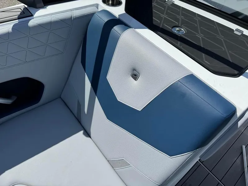 Slide: The Image of 2024 Nautique Super Air GS20 boat interior with blue and white upholstery. - 8
