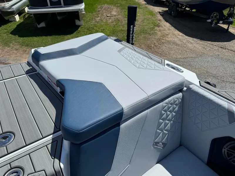 Slide: The Image of 2024 Nautique Super Air GS20 boat interior with gray and blue upholstery. - 9