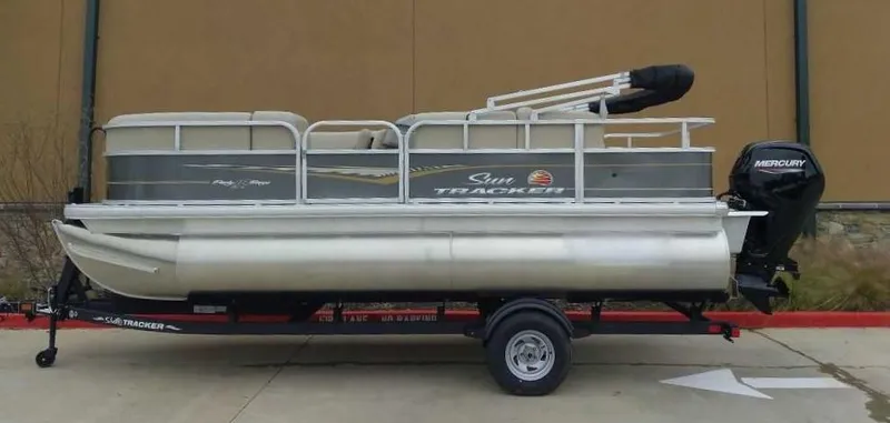 The Image of 2024 Sun Tracker Party Barge 18 DLX pontoon boat on trailer. - 0