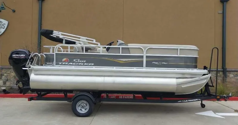 Slide: The Image of 2024 Sun Tracker Party Barge 18 DLX pontoon boat on a trailer. - 3