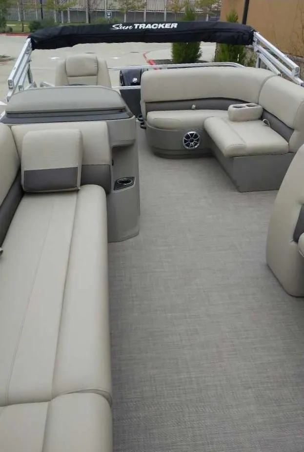 Slide: The Image of 2024 Sun Tracker Party Barge 18 DLX interior with spacious seating and modern design. - 8