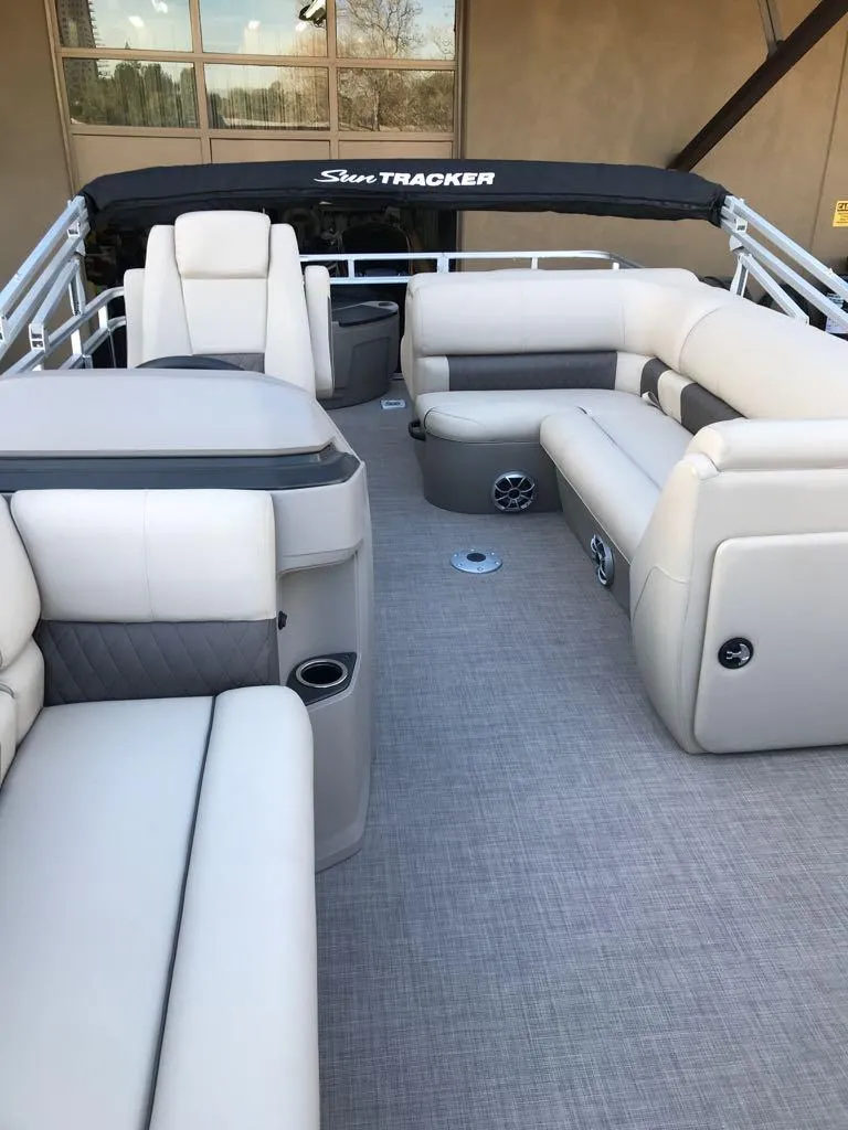 Slide: The Image of 2024 Sun Tracker SportFish 20 DLX pontoon boat with spacious seating and modern design. - 15