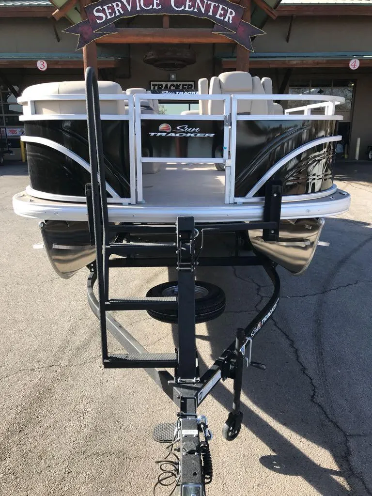Slide: The Image of 2024 Sun Tracker SportFish 20 DLX pontoon boat at service center. - 3