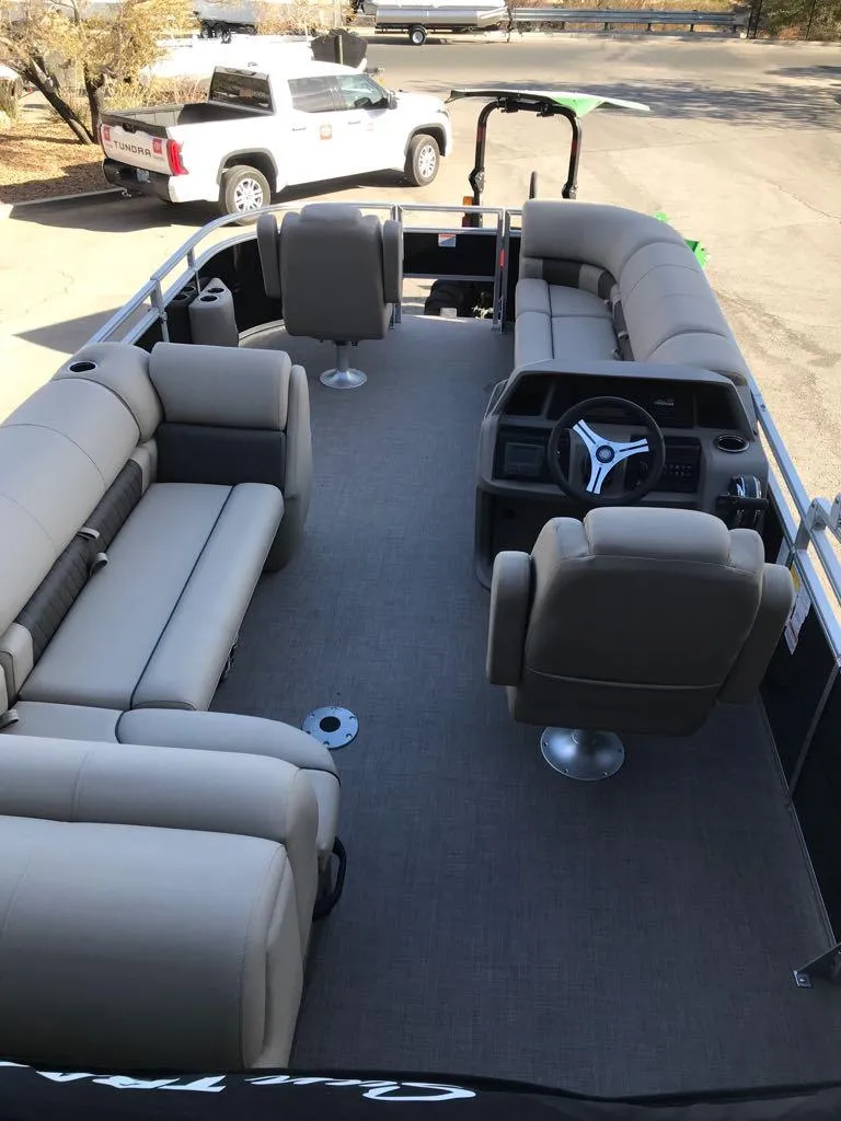 Slide: The Image of 2024 Sun Tracker SportFish 20 DLX pontoon boat with spacious seating and modern helm. - 8