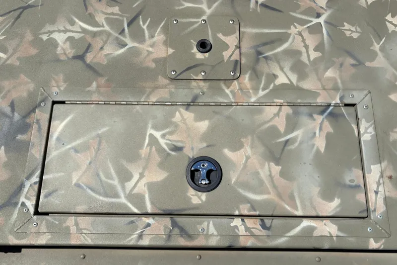 Slide: The Image of 2024 Tracker Grizzly 1754 SC boat with camouflage pattern and secure hatch. - 22
