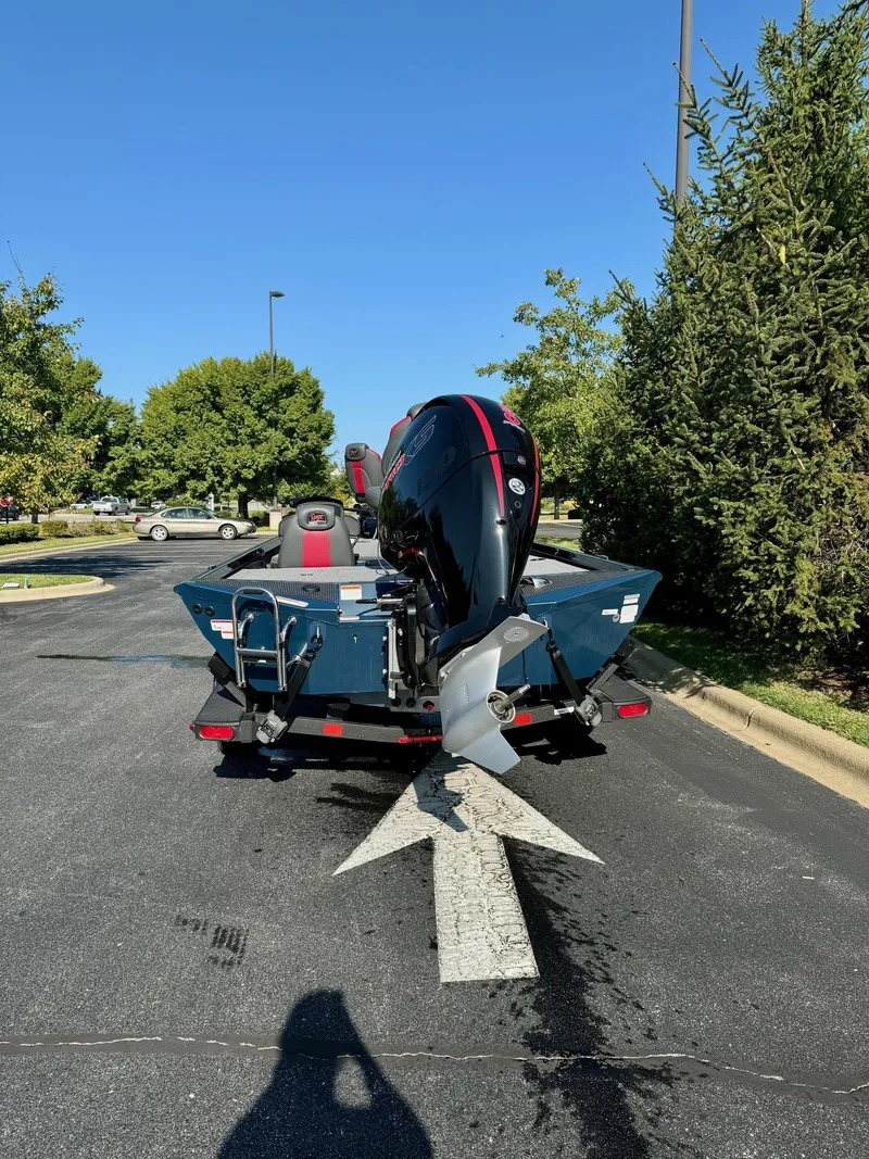 Slide: The Image of 2024 Ranger RT198P boat on trailer, parked outdoors, rear view. - 5