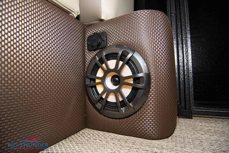 Slide: The Image of 2023 Crest Classic DLX 240 SLC boat interior speaker and upholstery detail. - 18