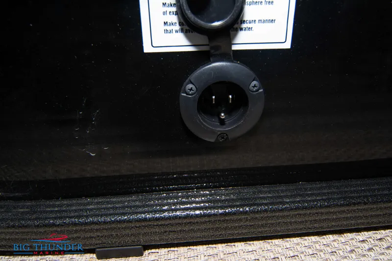 Slide: The Image of 2023 Crest Classic DLX 240 SLC boat power outlet close-up. - 42