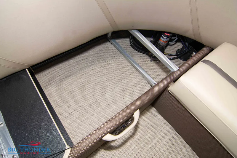 Slide: The Image of 2023 Crest Classic DLX 240 SLC boat interior storage compartment. - 43