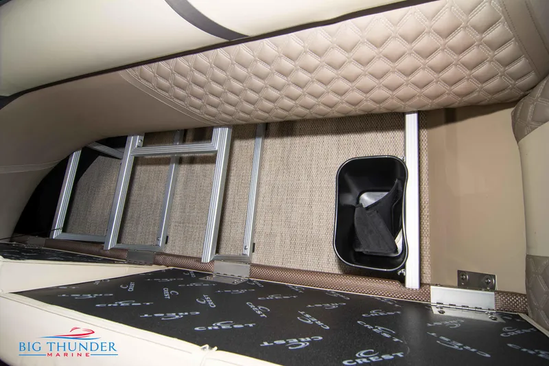 Slide: The Image of 2023 Crest Classic DLX 240 SLC interior storage compartment with ladder and cup holder. - 45