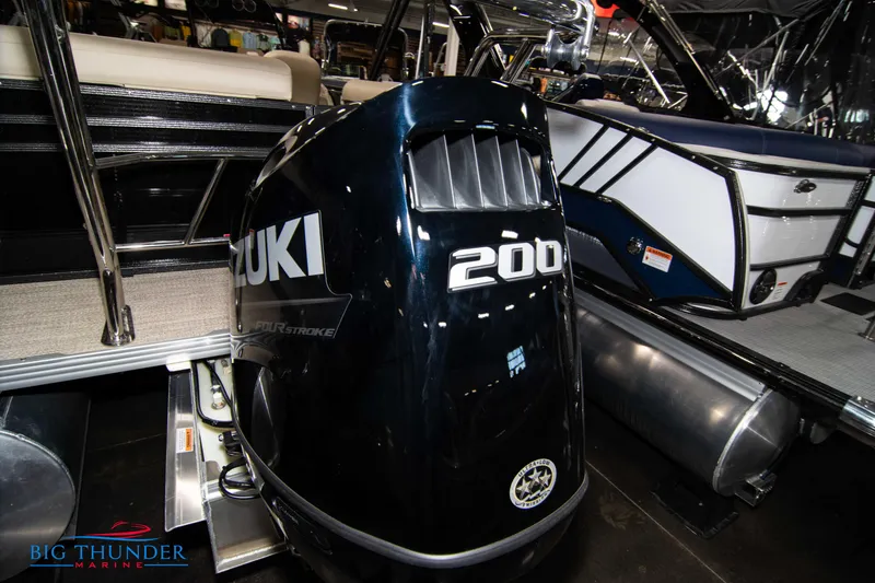 Slide: The Image of 2023 Crest Classic DLX 240 SLC with Suzuki 200 outboard motor at Big Thunder Marine. - 5