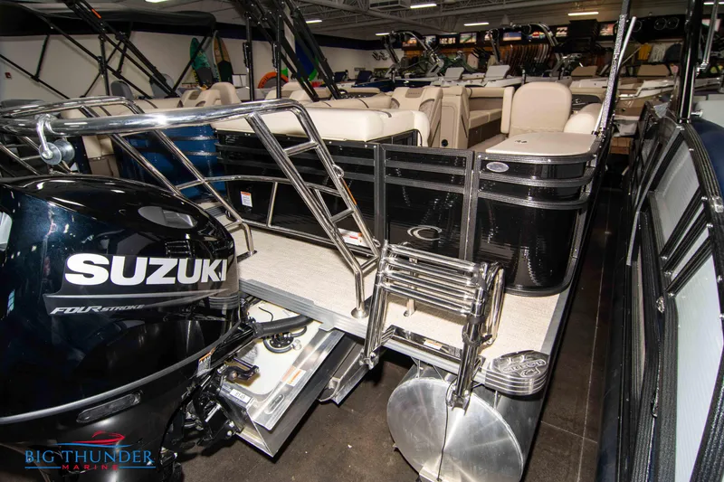 Slide: The Image of 2023 Crest Classic DLX 240 SLC pontoon boat with Suzuki outboard motor in showroom. - 6