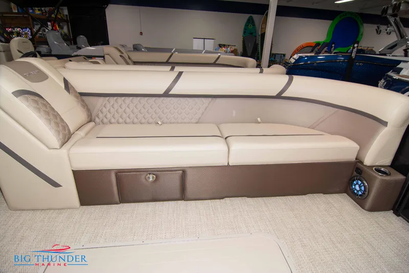 Slide: The Image of 2023 Crest Classic DLX 240 SLC pontoon boat interior with beige seating. - 8