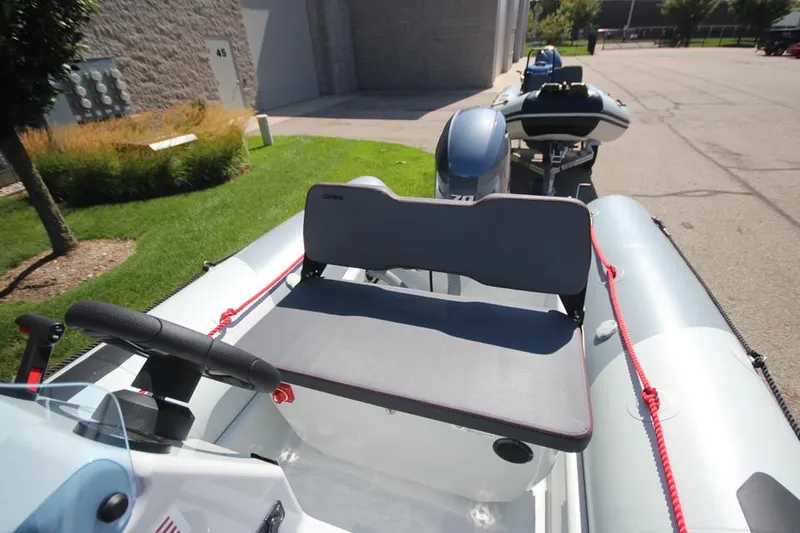 Slide: The Image of 2024 Zodiac Open 4.8 NEO 70hp inflatable boat, interior view with seating. - 10