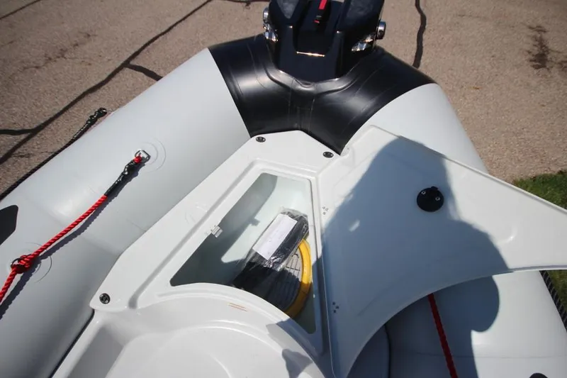 Slide: The Image of 2024 Zodiac Open 4.8 NEO 70hp boat storage compartment with accessories. - 17