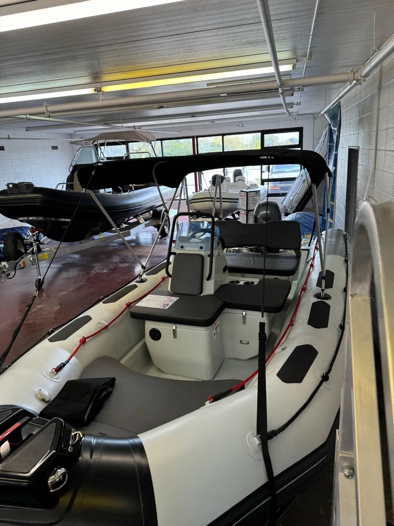 Slide: The Image of 2024 Zodiac Open 4.8 NEO boat with 70hp engine in showroom. - 20