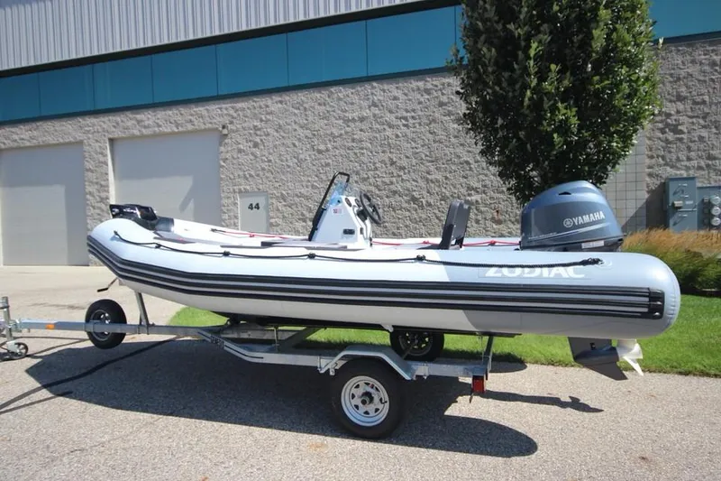 Slide: The Image of 2024 Zodiac Open 4.8 NEO 70hp boat on trailer, side view. - 6