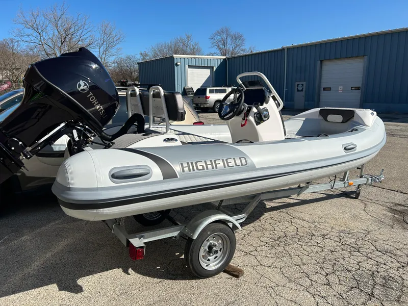 Slide: The Image of 2023 Highfield Sport 420 inflatable boat on a trailer with a Yamaha outboard motor. - 3
