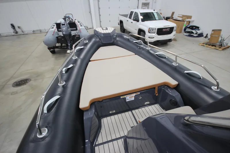 Slide: The Image of 2024 Zodiac Medline 6.8 NEO 250hp boat in stock, indoor showroom view. - 15