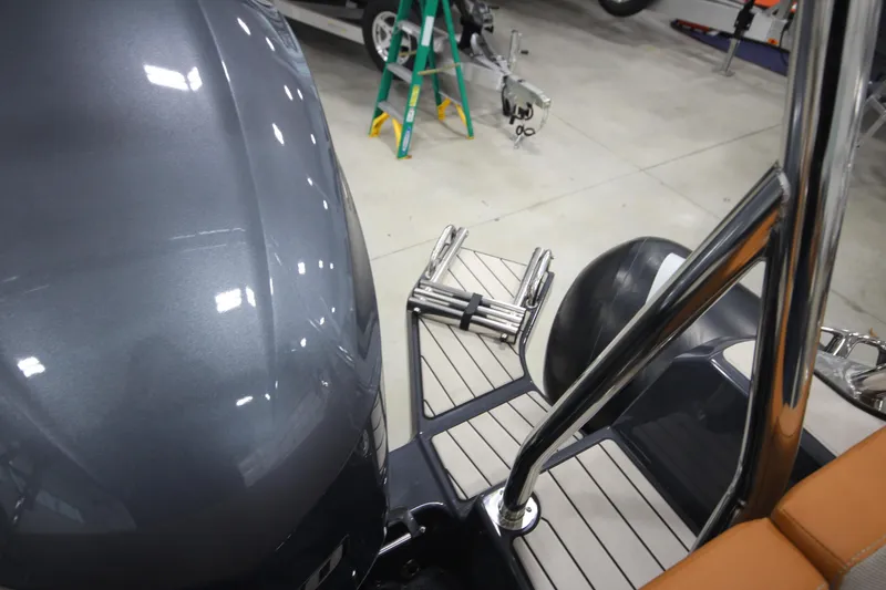 Slide: The Image of 2024 Zodiac Medline 6.8 NEO 250hp boat with ladder and deck in showroom. - 24