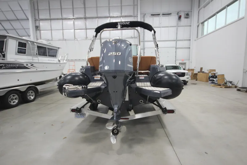 Slide: The Image of 2024 Zodiac Medline 6.8 NEO 250hp boat in stock, rear view in showroom. - 8