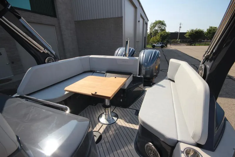 Slide: The Image of 2024 Zodiac MEDLINE 9 NEO boat interior with seating and table, twin 300hp engines. - 10