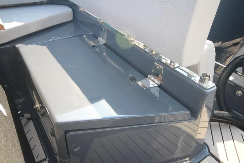 Slide: The Image of 2024 Zodiac MEDLINE 9 NEO boat interior, featuring sleek seating and storage area. - 12