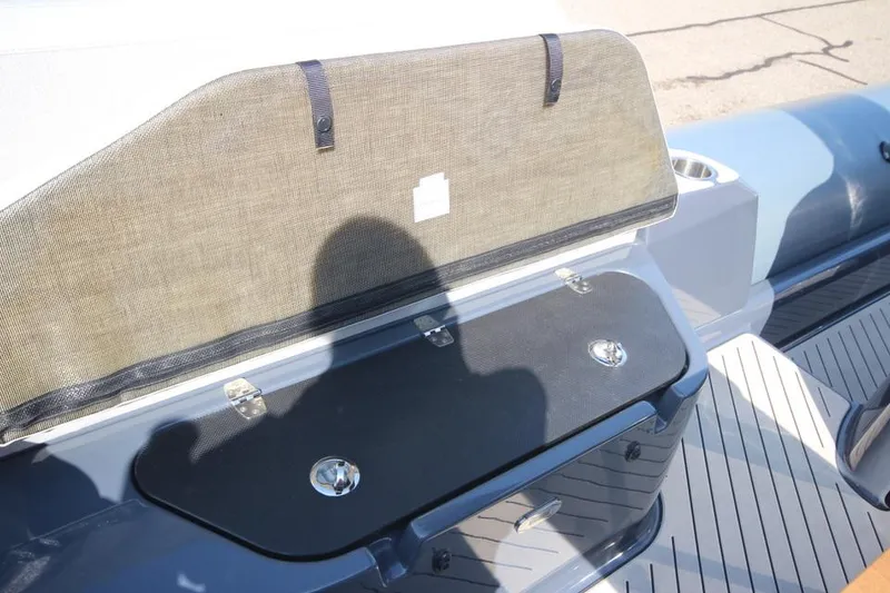 Slide: The Image of 2024 Zodiac MEDLINE 9 NEO boat interior with storage compartment and seating. - 14