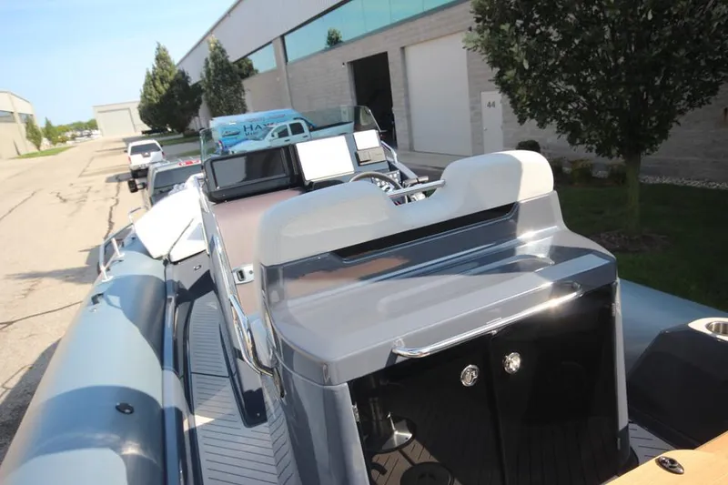 Slide: The Image of 2024 Zodiac MEDLINE 9 NEO boat, sleek design, twin 300hp engines, parked outdoors. - 15