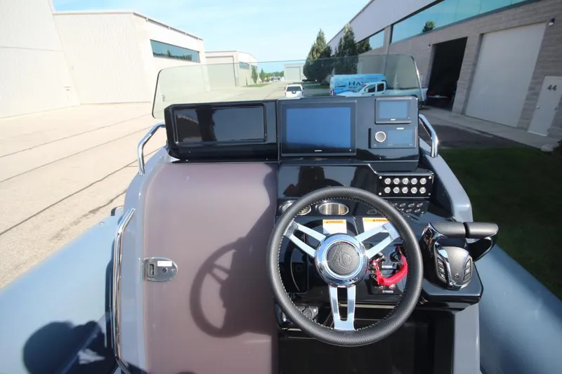 Slide: The Image of 2024 Zodiac MEDLINE 9 NEO boat dashboard with steering wheel and control panel. - 20