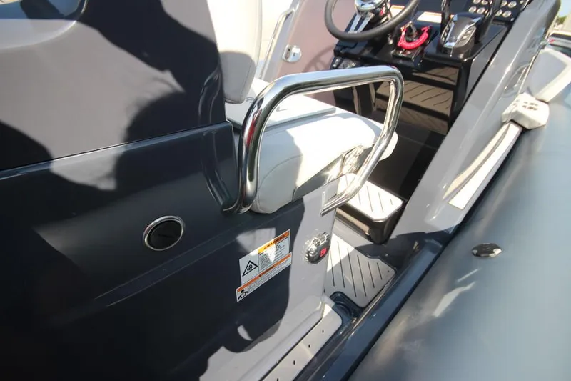 Slide: The Image of 2024 Zodiac MEDLINE 9 NEO boat interior with control panel and seating. - 22