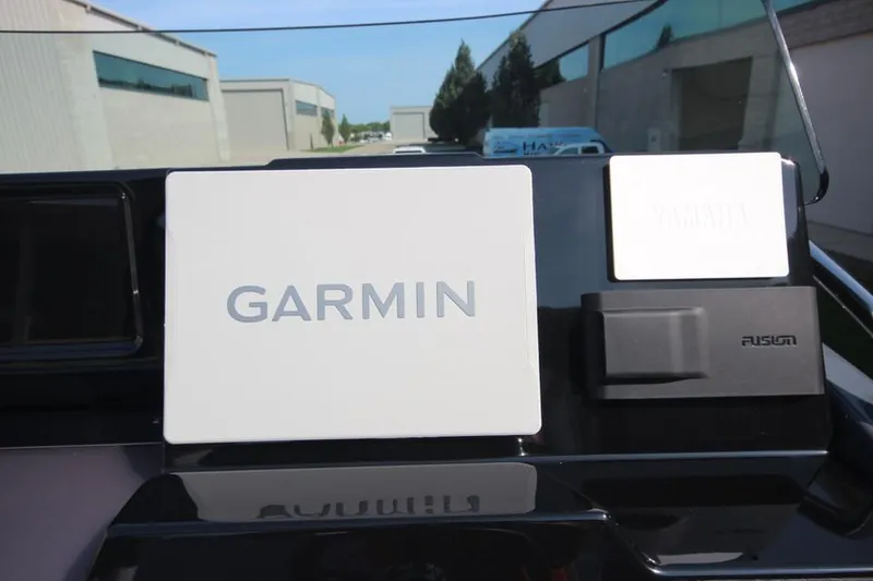 Slide: The Image of Garmin and Fusion equipment on 2024 Zodiac MEDLINE 9 NEO boat dashboard. - 23