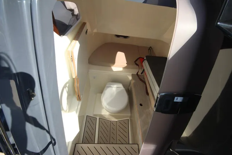 Slide: The Image of 2024 Zodiac MEDLINE 9 NEO boat interior cabin with seating and storage. - 25