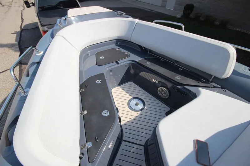 Slide: The Image of 2024 Zodiac MEDLINE 9 NEO boat interior with seating and storage compartments. - 29