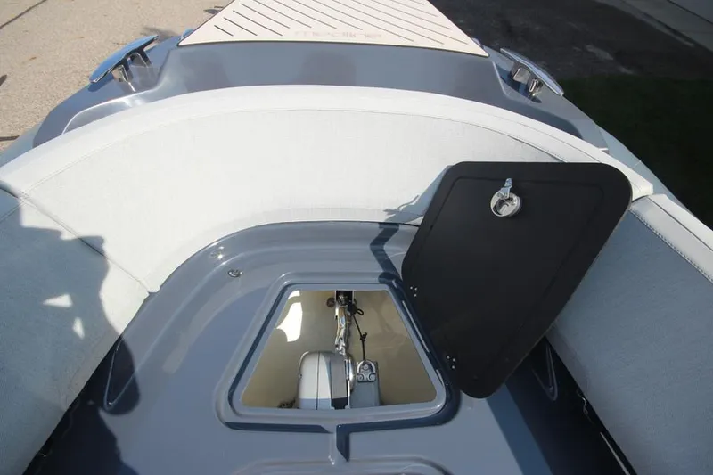 Slide: The Image of 2024 Zodiac MEDLINE 9 NEO boat interior with open storage compartment. - 31