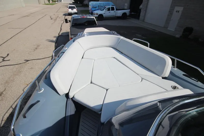 Slide: The Image of 2024 Zodiac MEDLINE 9 NEO boat with spacious sunbathing area, parked outdoors. - 32