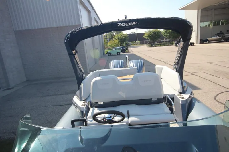 Slide: The Image of 2024 Zodiac MEDLINE 9 NEO boat with twin 300hp engines, docked outdoors. - 34