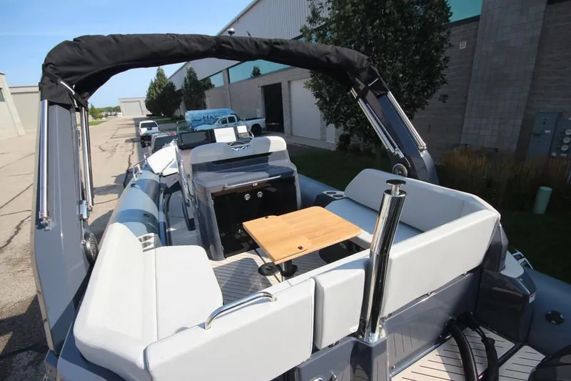 Slide: The Image of 2024 Zodiac MEDLINE 9 NEO boat with twin 300hp engines, featuring spacious seating and sleek design. - 7