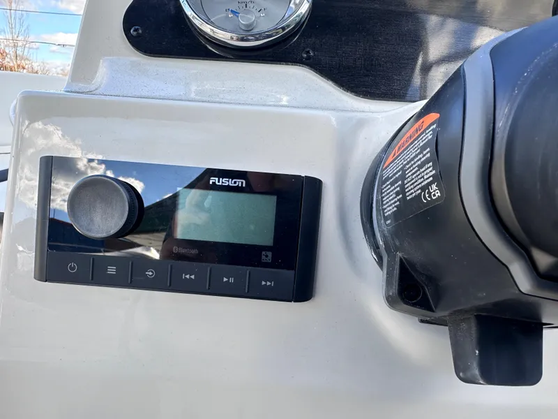 Slide: The Image of Fusion stereo system on 2024 Stingray 172 SC boat dashboard. - 11