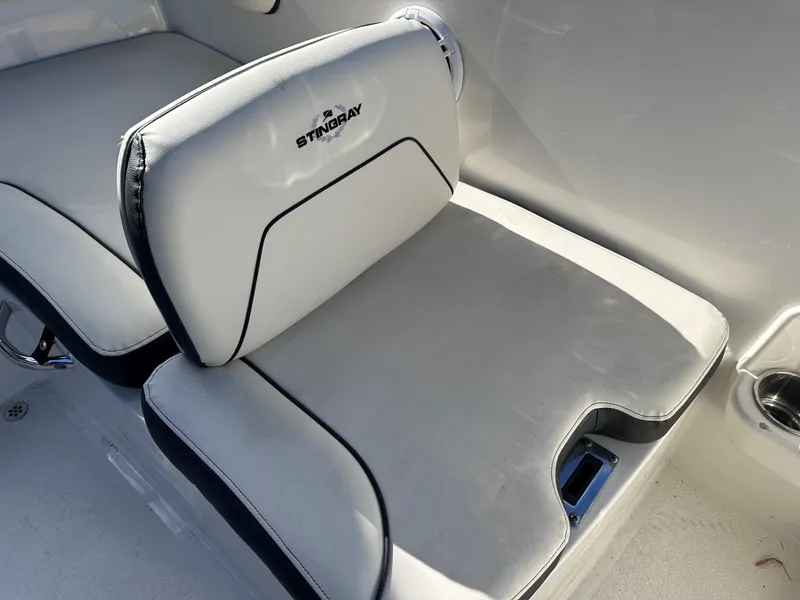 Slide: The Image of 2024 Stingray 172 SC boat seat with white and black upholstery. - 14