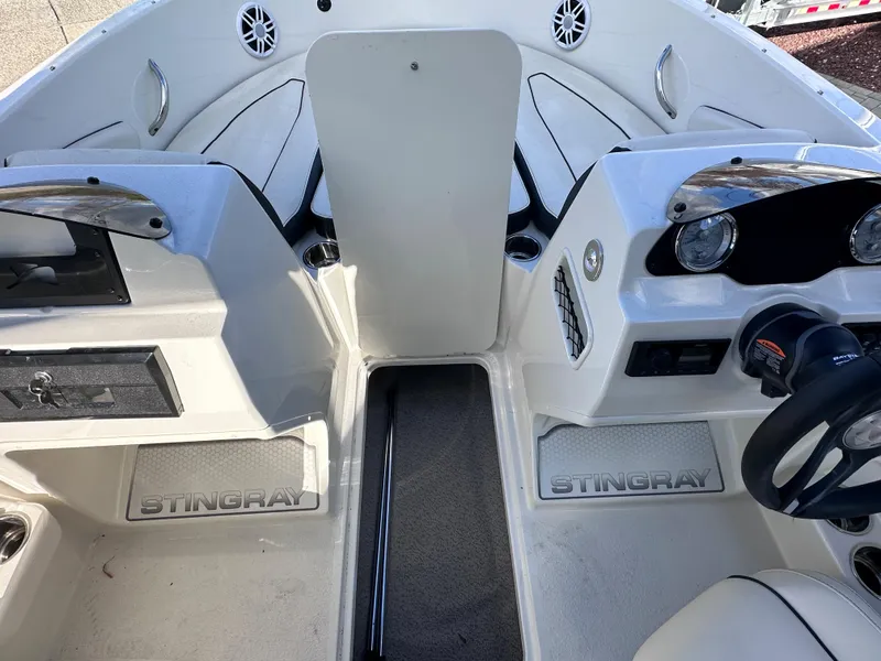 Slide: The Image of 2024 Stingray 172 SC boat interior with dual consoles and steering wheel. - 16