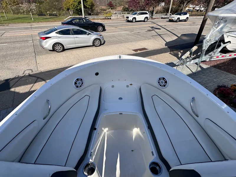 Slide: The Image of 2024 Stingray 172 SC boat interior with seating and cup holders. - 20