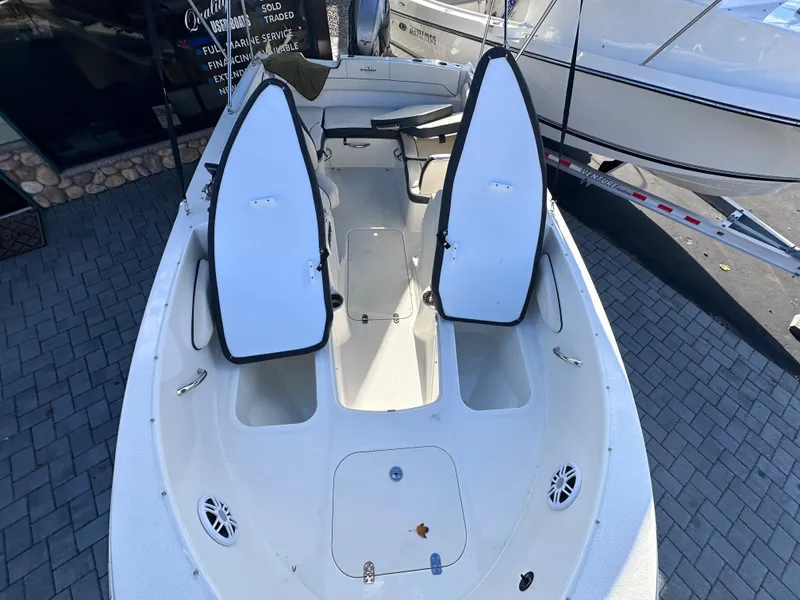 Slide: The Image of 2024 Stingray 172 SC boat interior with open storage compartments. - 21