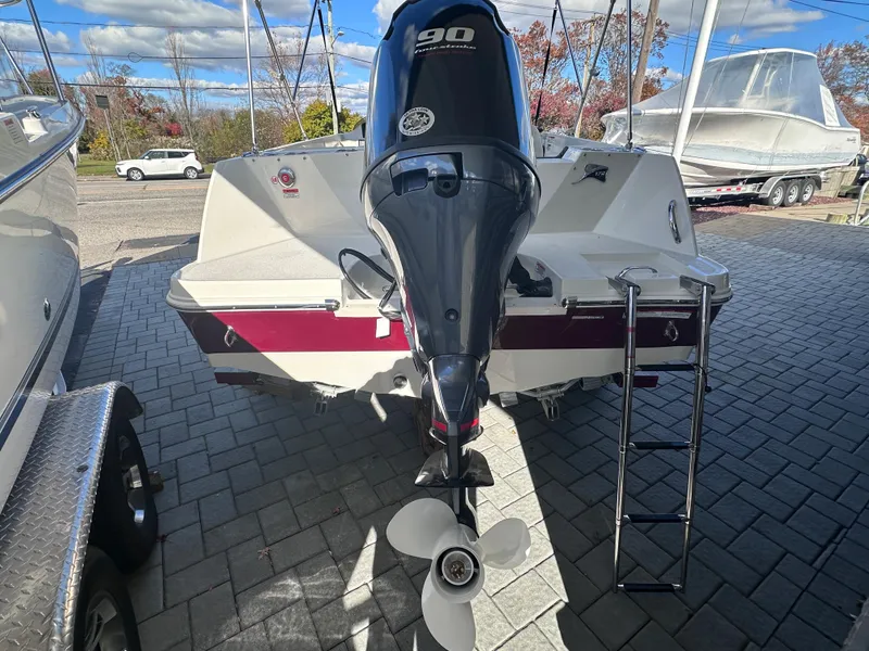 Slide: The Image of 2024 Stingray 172 SC boat with 90 HP outboard motor, rear view. - 3