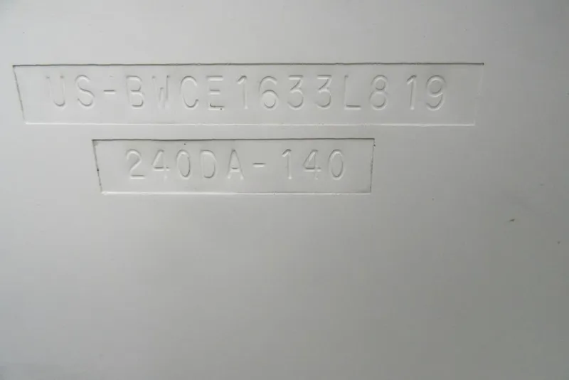 Slide: The Image of 2019 Boston Whaler 240 Dauntless hull identification number embossed on white surface. - 23