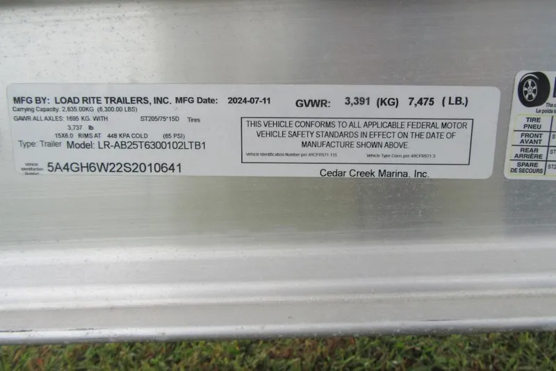 Slide: The Image of Label on Load Rite trailer, model LR-AB25T6300102LTB1, manufactured 2024, for Boston Whaler 240 Dauntless. - 25